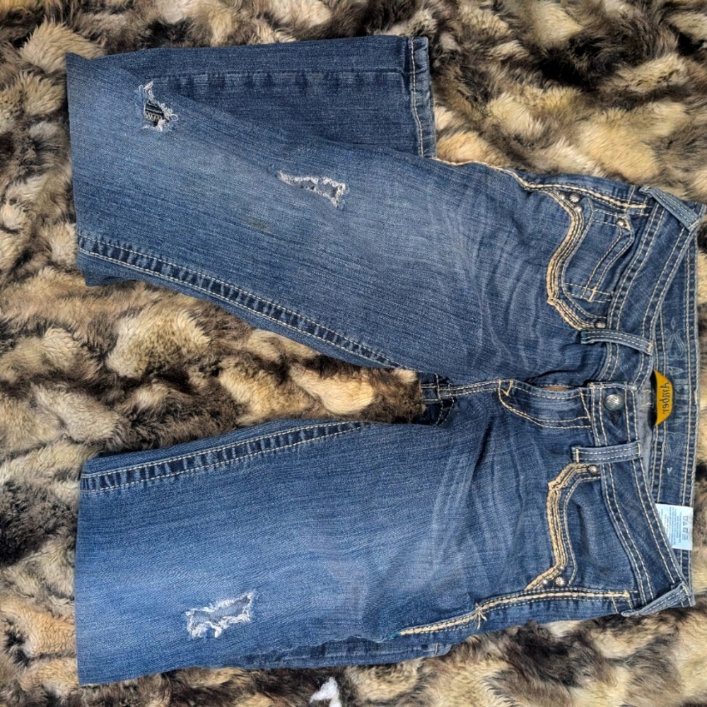 Amber embellished jeans. Stud detail with turquoise and thick stitch pocket.